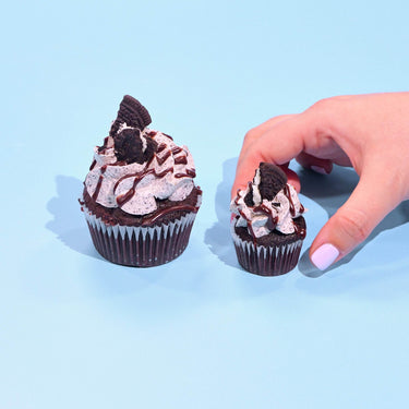 Oreo Cupcakes with chocolate sponge, Oreo icing, ganache drizzle, and Oreo cookie topping by Crumbs & Doilies